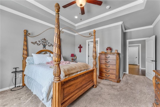 carpeted bedroom with a ceiling fan, baseboards, and ornamental molding