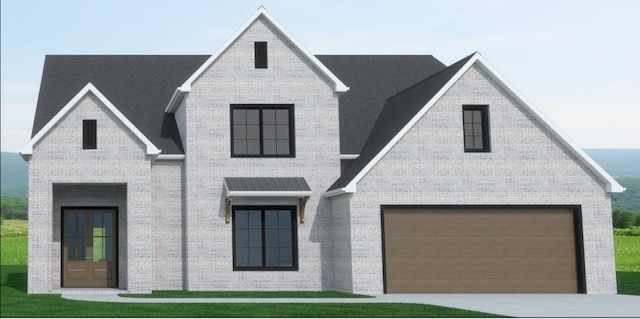 view of front of home featuring a front yard, an attached garage, brick siding, and driveway