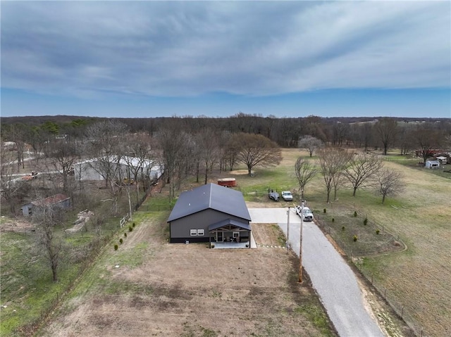 birds eye view of property with a rural view