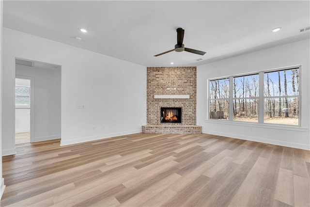 unfurnished living room with visible vents, baseboards, ceiling fan, recessed lighting, and light wood-style flooring