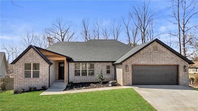 view of front of property with brick siding, fence, concrete driveway, a front yard, and a garage