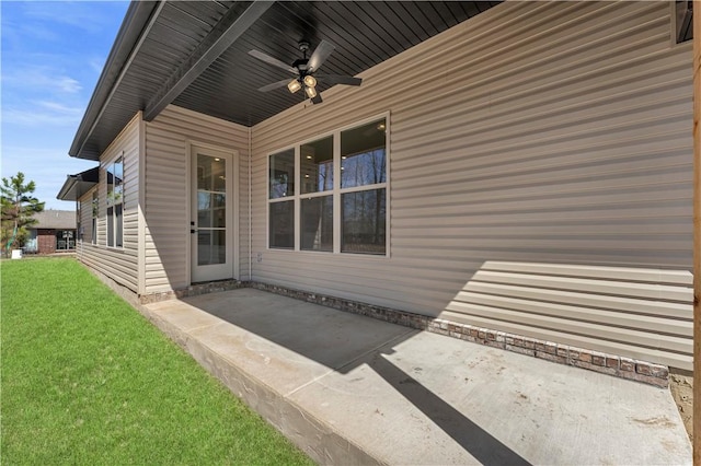 exterior space with a lawn, a patio, and ceiling fan