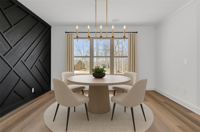 4 Stobo Ln, Bella Vista, AR 72715 - dining area featuring ornamental molding, baseboards, and light wood-style flooring