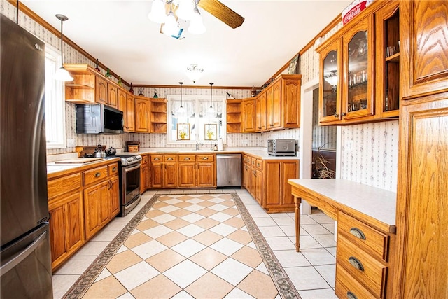 kitchen featuring a wealth of natural light, appliances with stainless steel finishes, wallpapered walls, and open shelves