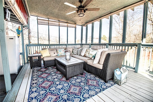 sunroom with a ceiling fan