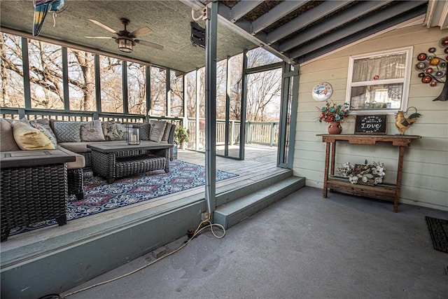 sunroom with vaulted ceiling and ceiling fan