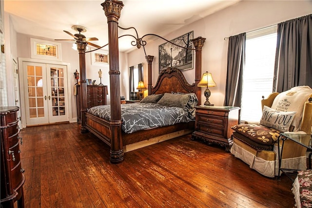 bedroom with french doors and hardwood / wood-style floors