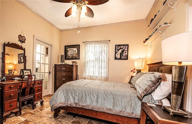 bedroom featuring a textured ceiling, ceiling fan, and crown molding