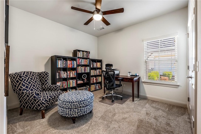 home office featuring carpet flooring, visible vents, baseboards, and ceiling fan