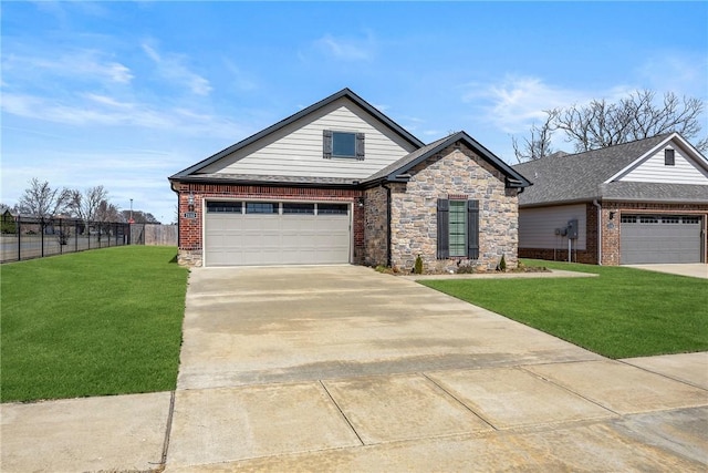 view of front of house with a front lawn, fence, a garage, stone siding, and driveway