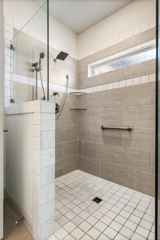 full bathroom with a tile shower