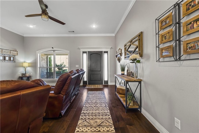 living room featuring baseboards, dark wood-type flooring, and ornamental molding