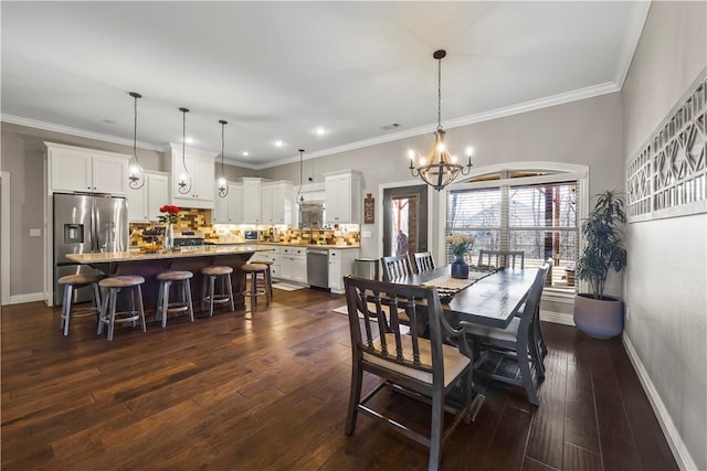 dining area featuring an inviting chandelier, dark wood-style floors, baseboards, and ornamental molding