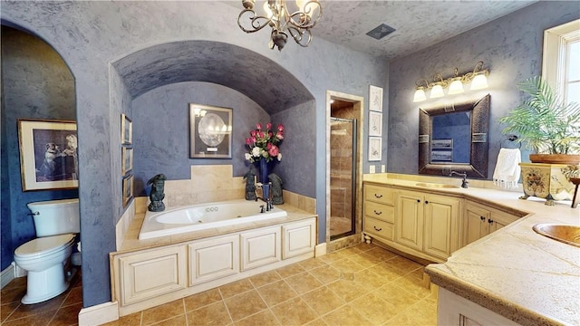 full bath with a garden tub, a stall shower, an inviting chandelier, tile patterned floors, and vanity