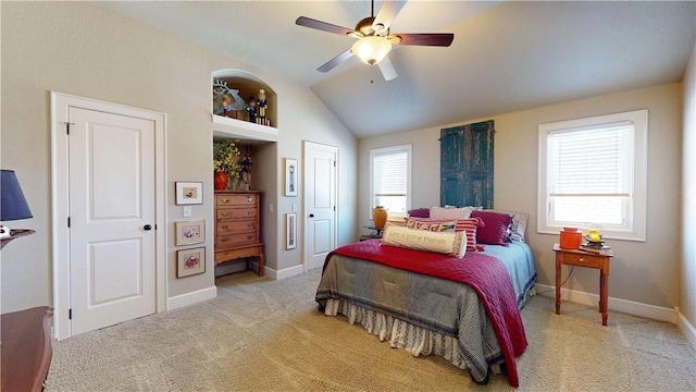 bedroom with baseboards, light carpet, a ceiling fan, and vaulted ceiling