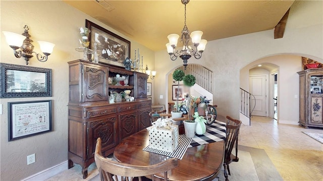 dining room featuring visible vents, stairway, arched walkways, an inviting chandelier, and light tile patterned flooring