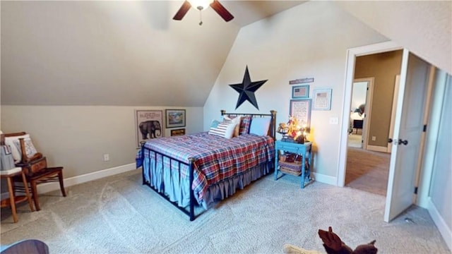 carpeted bedroom featuring baseboards, lofted ceiling, and a ceiling fan