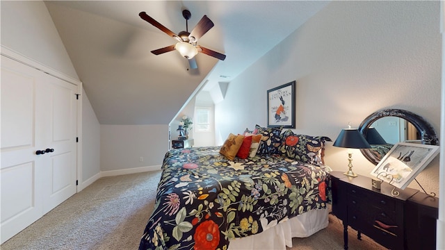 bedroom featuring carpet flooring, baseboards, lofted ceiling, and a ceiling fan