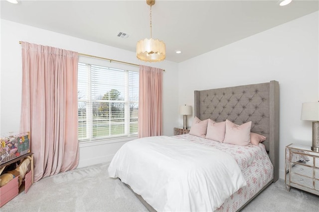 carpeted bedroom featuring recessed lighting, visible vents, and baseboards