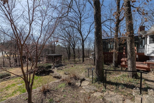 view of yard with a wooden deck