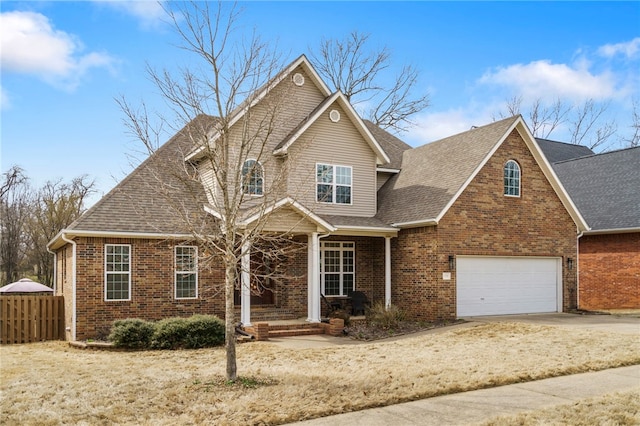 view of front of home with fence, concrete driveway, an attached garage, a shingled roof, and brick siding