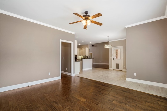 unfurnished living room with a ceiling fan, baseboards, light wood finished floors, recessed lighting, and crown molding