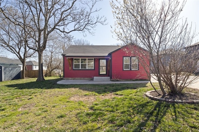 view of shed with entry steps and fence