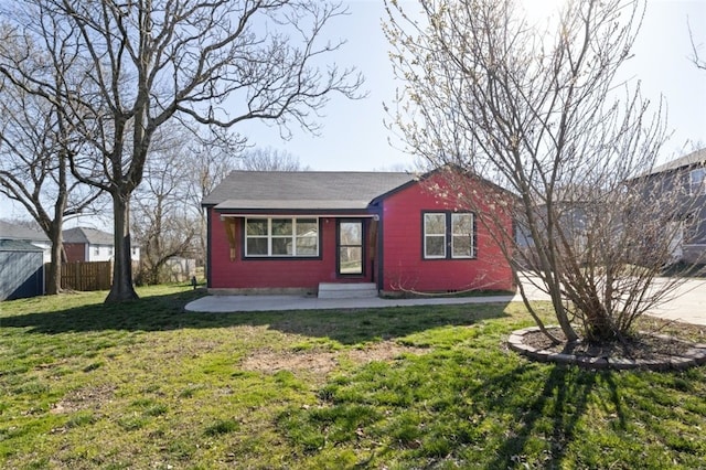 view of outbuilding featuring entry steps and fence