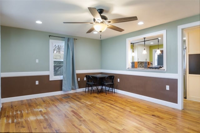 empty room featuring recessed lighting, baseboards, a ceiling fan, and wood finished floors