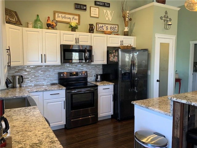 kitchen with dark wood-style floors, decorative backsplash, white cabinets, and black appliances