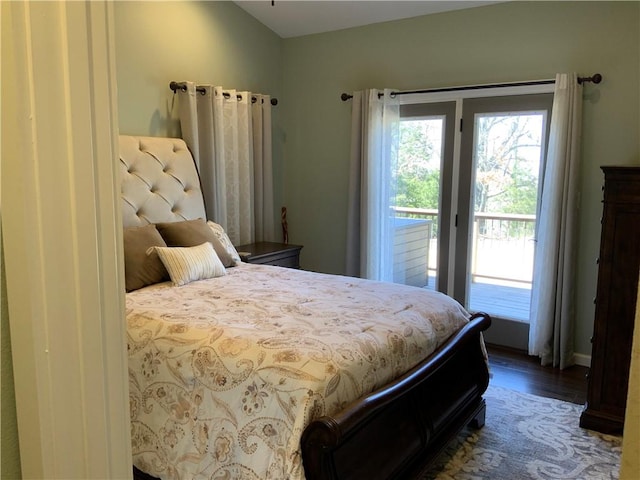 bedroom with wood finished floors and access to outside