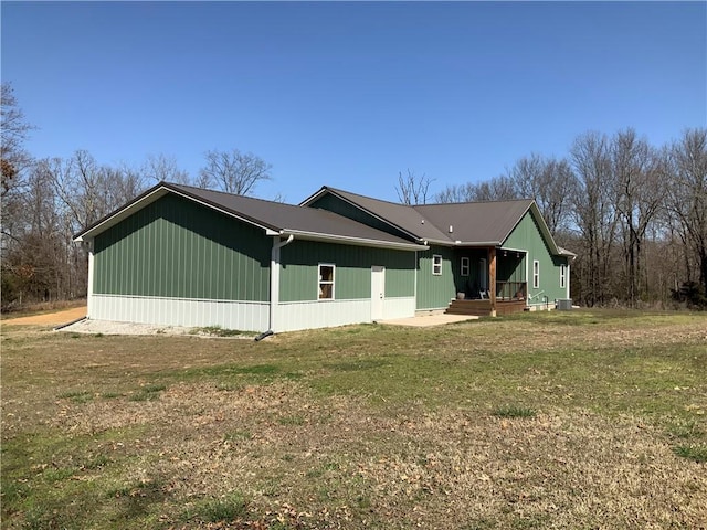 view of property exterior featuring a yard and central AC