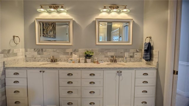 full bathroom featuring double vanity and a sink