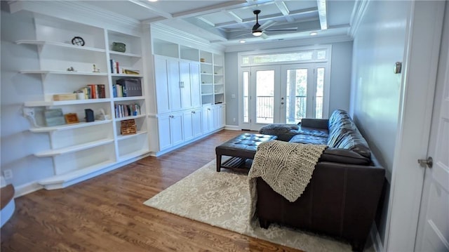 living area featuring a ceiling fan, coffered ceiling, wood finished floors, french doors, and crown molding