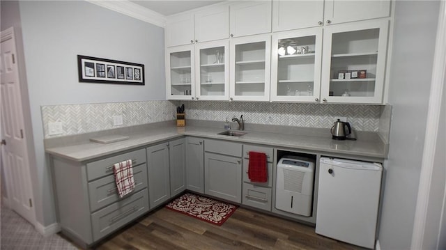 19 Razorback Rd, Rogers, AR 72758 - bar featuring dark wood-style flooring, backsplash, refrigerator, and crown molding
