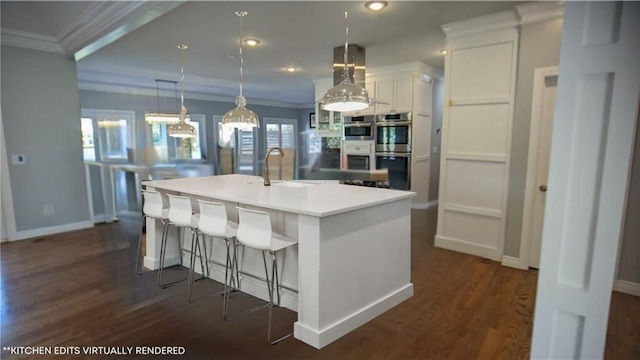 kitchen featuring a sink, stainless steel double oven, white cabinets, and ornamental molding