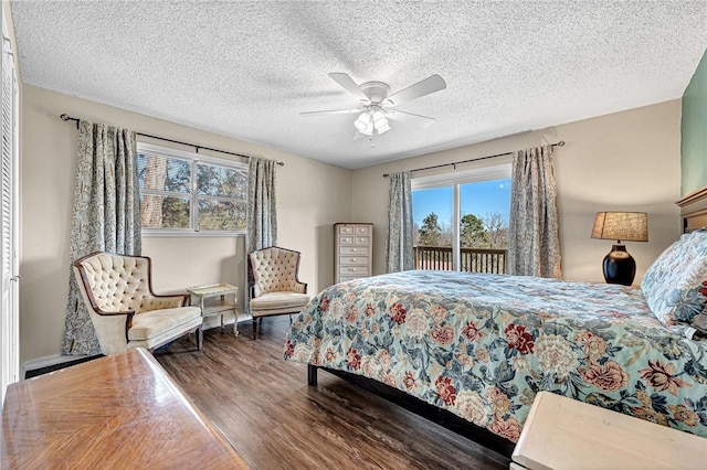 bedroom with a ceiling fan, access to exterior, wood finished floors, and a textured ceiling