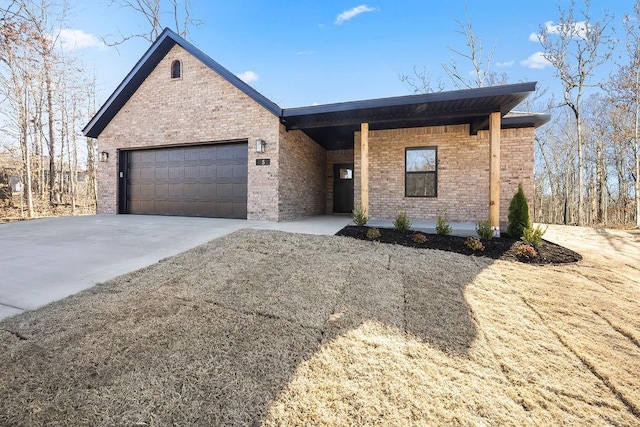 ranch-style home featuring brick siding, concrete driveway, and an attached garage