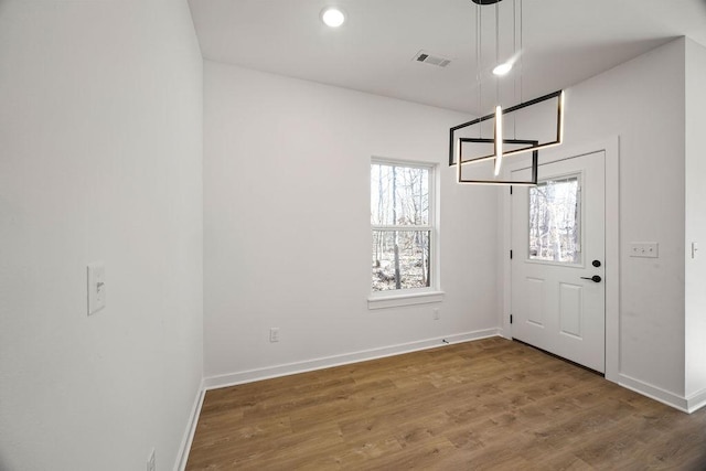 entryway with visible vents, recessed lighting, baseboards, and wood finished floors