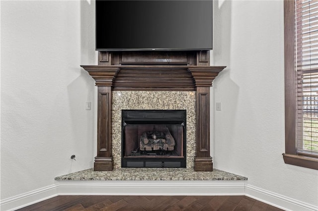 room details featuring baseboards and wood finished floors