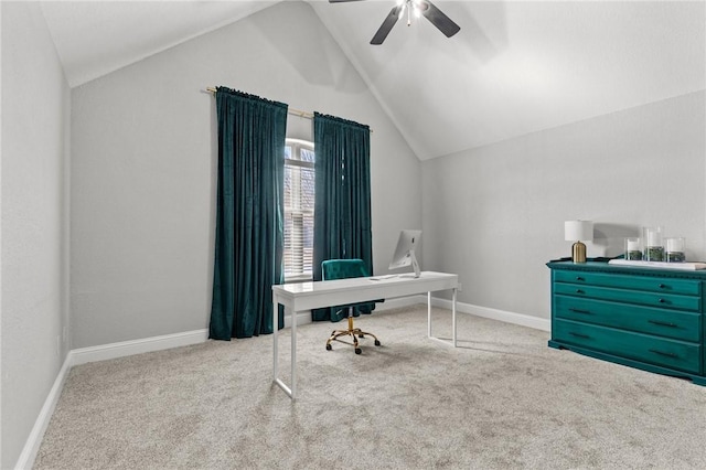 carpeted office with baseboards, ceiling fan, and vaulted ceiling