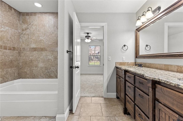 bathroom featuring vanity, baseboards, tile patterned flooring, and ceiling fan