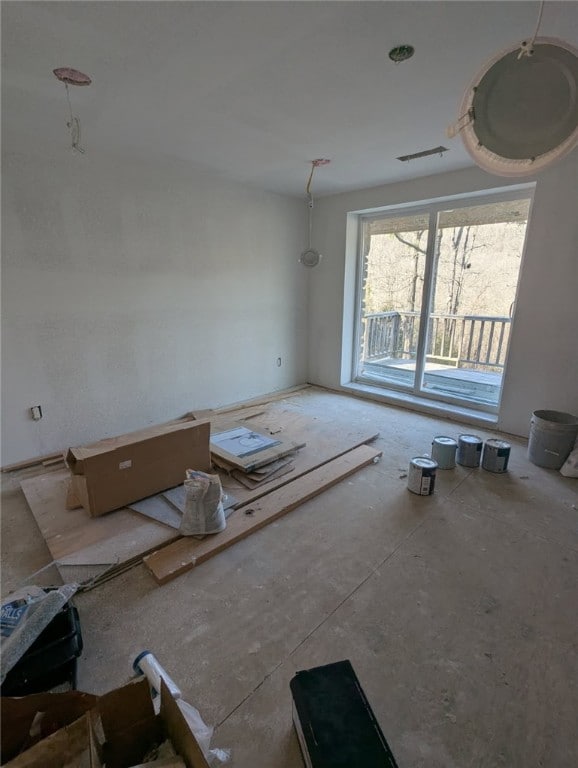 unfurnished living room featuring visible vents