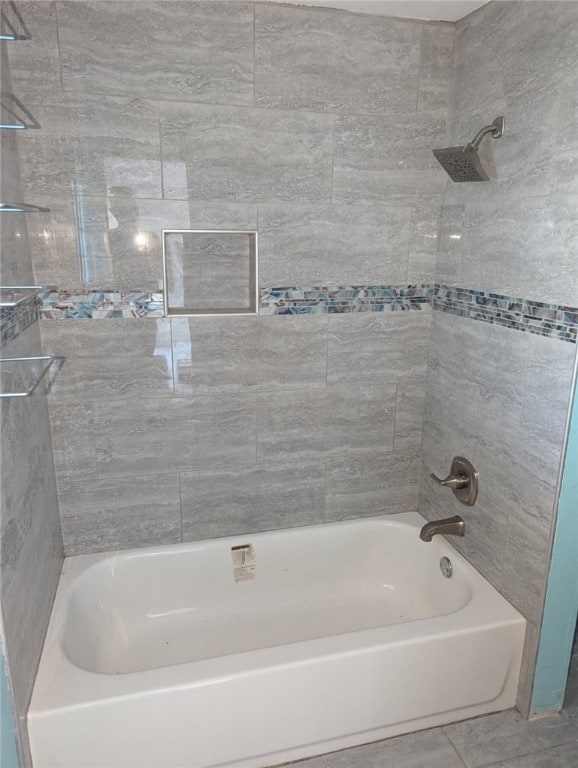 full bath featuring tile patterned floors and shower / washtub combination