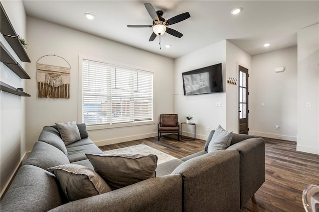 living room featuring recessed lighting, baseboards, dark wood-type flooring, and a ceiling fan