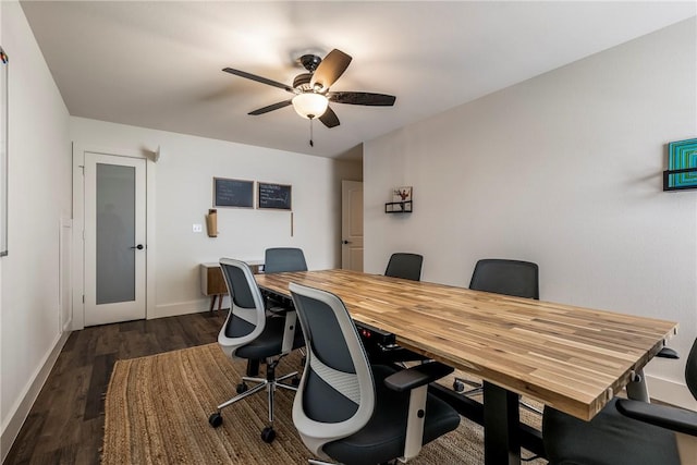 home office with baseboards, dark wood-type flooring, and ceiling fan