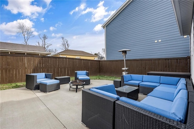 view of patio / terrace featuring an outdoor living space with a fire pit and a fenced backyard