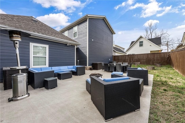 view of patio / terrace featuring an outdoor living space, a fenced backyard, and outdoor dining space