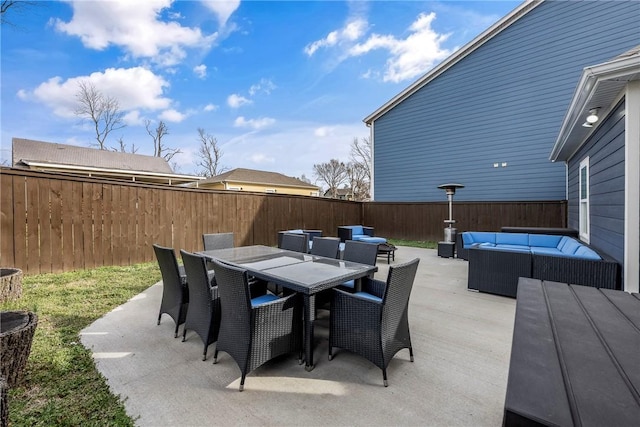 view of patio / terrace with an outdoor living space, outdoor dining area, and a fenced backyard