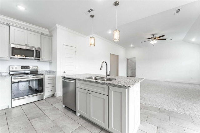 kitchen featuring a ceiling fan, visible vents, gray cabinets, a sink, and appliances with stainless steel finishes